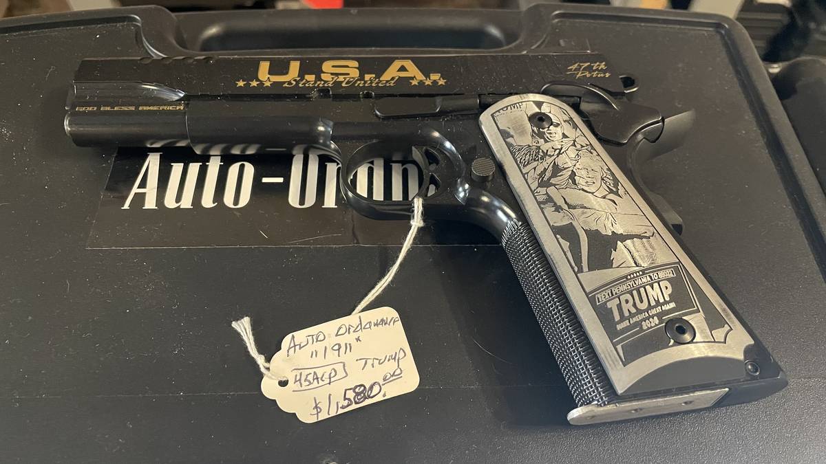 Auto-Ordnance 1911 .45 ACP Trump 47th POTUS commemorative pistol with U.S.A. Stand United engraving and etched grips, available at Guns and Glory in Le Roy, Illinois.
