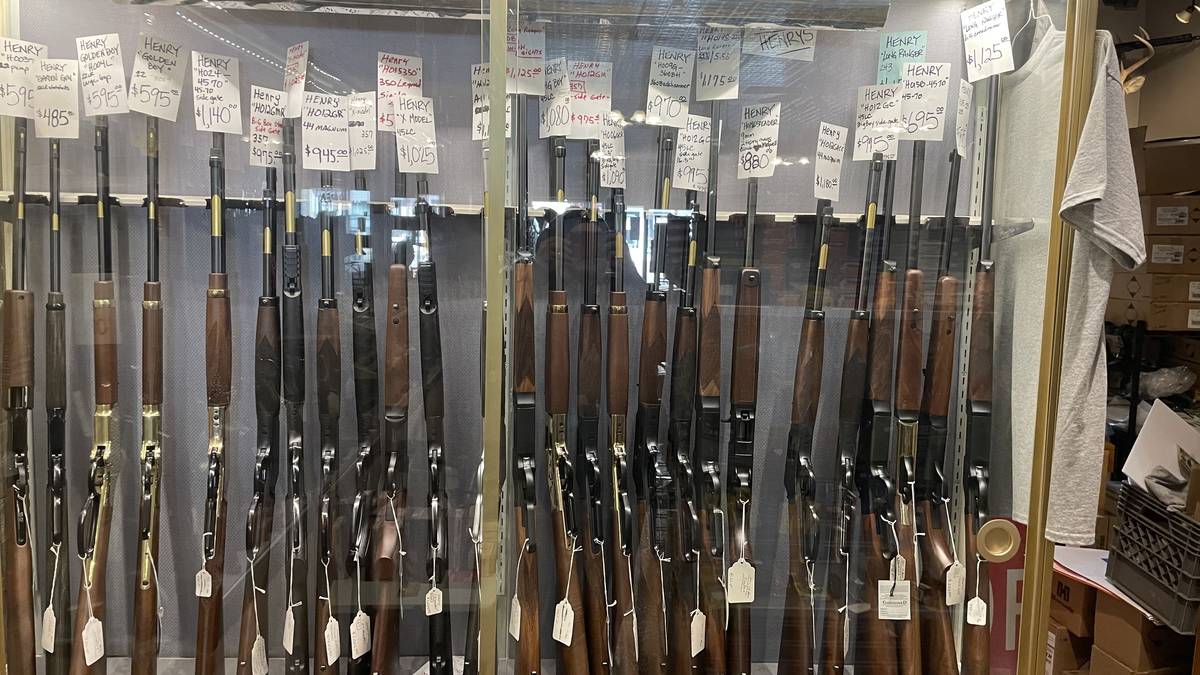 Henry Repeating Arms wall featuring Big Boy Side Gate .45-70, X Model in .357 and .45 LC, Long Ranger 6.5 Creedmoor, Homesteader 9mm, Golden Boy, and H012 series rifles.