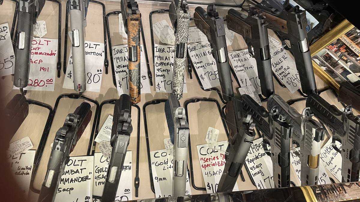 1911 special editions: Iver Johnson Copperhead and Eagle XL with snake-skin finishes, Colt Series 70, Colt Combat Commander Lightweight, Colt Gold Cup, and Kimber Rapide Scorpius.